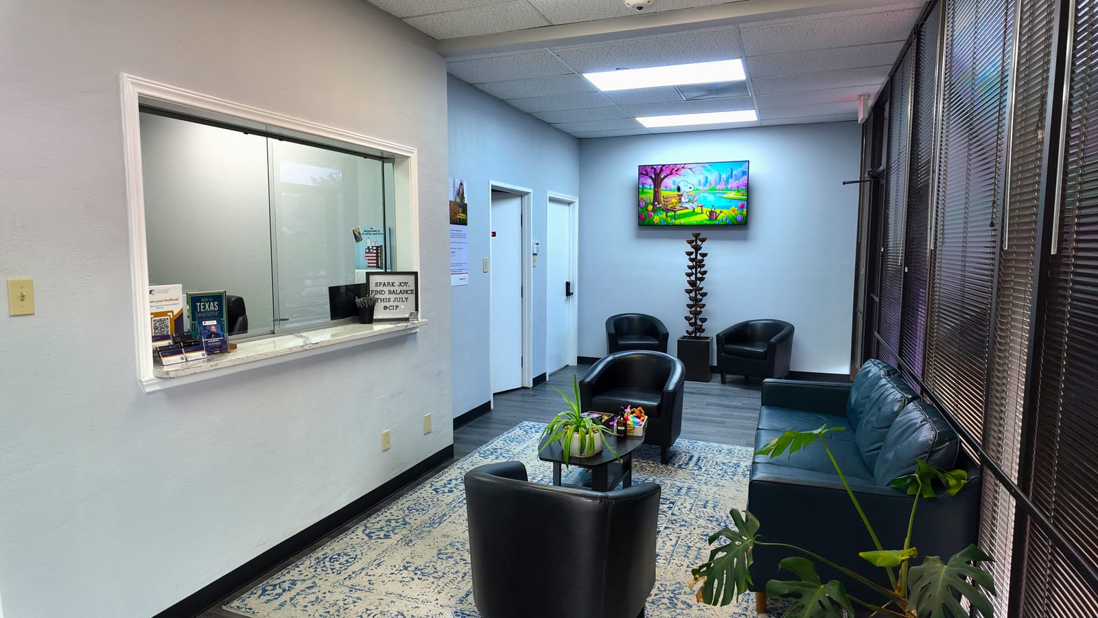 The waiting room at our Coppell office, with the front-desk window and seating