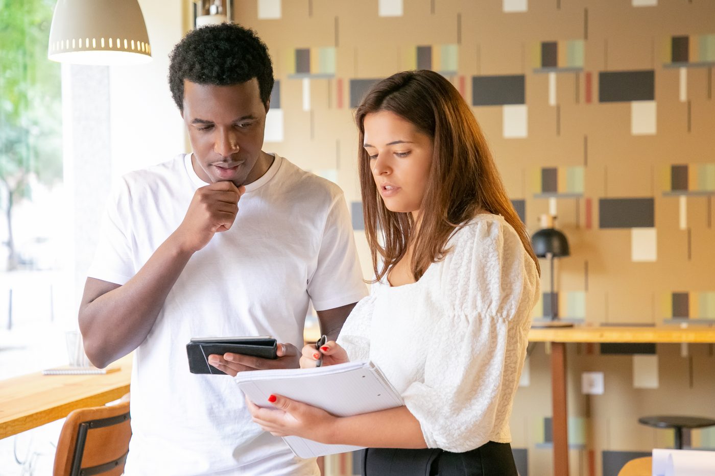 A coach and client mapping out goals