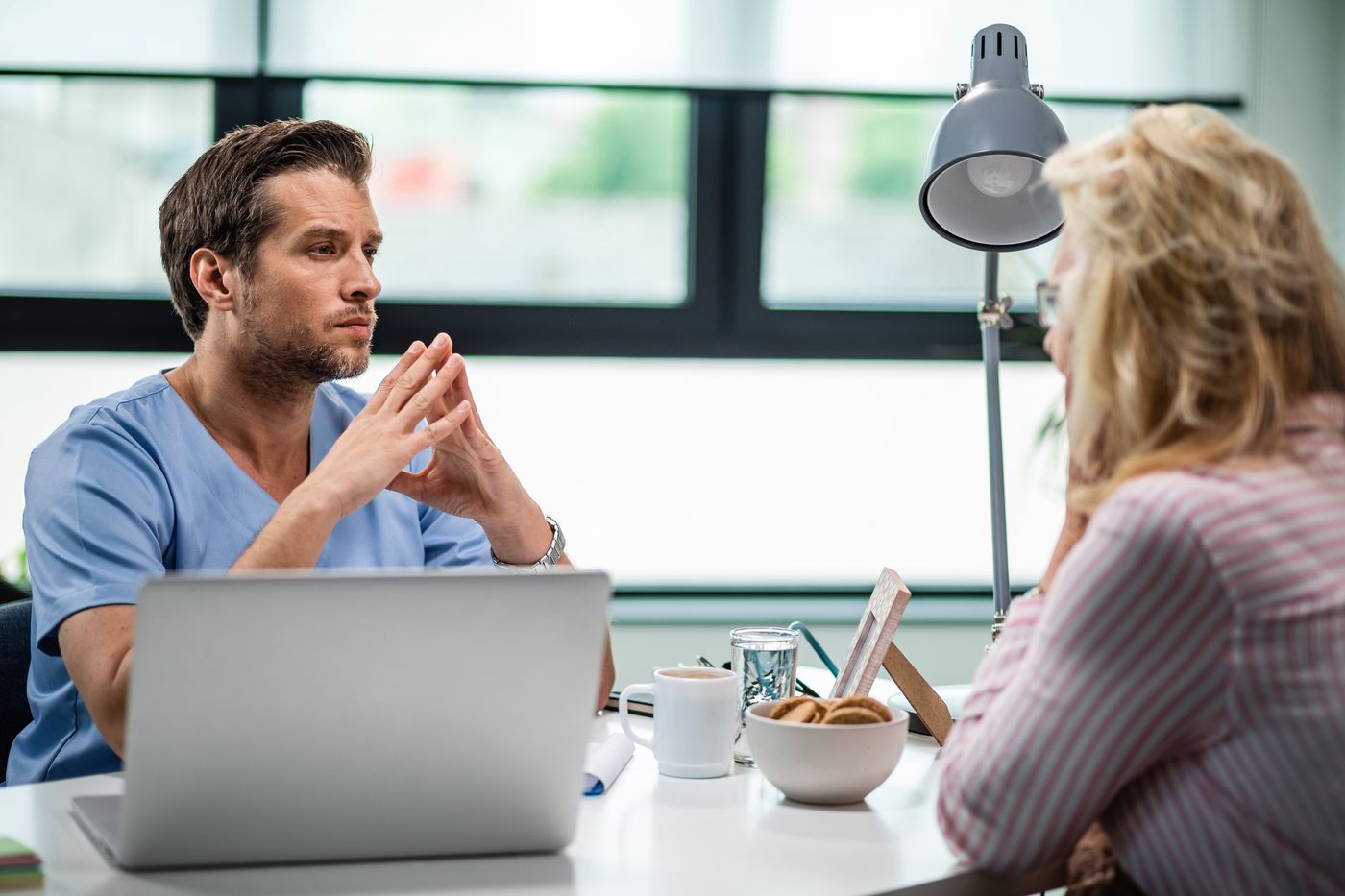 A clinician and patient talking through goals
